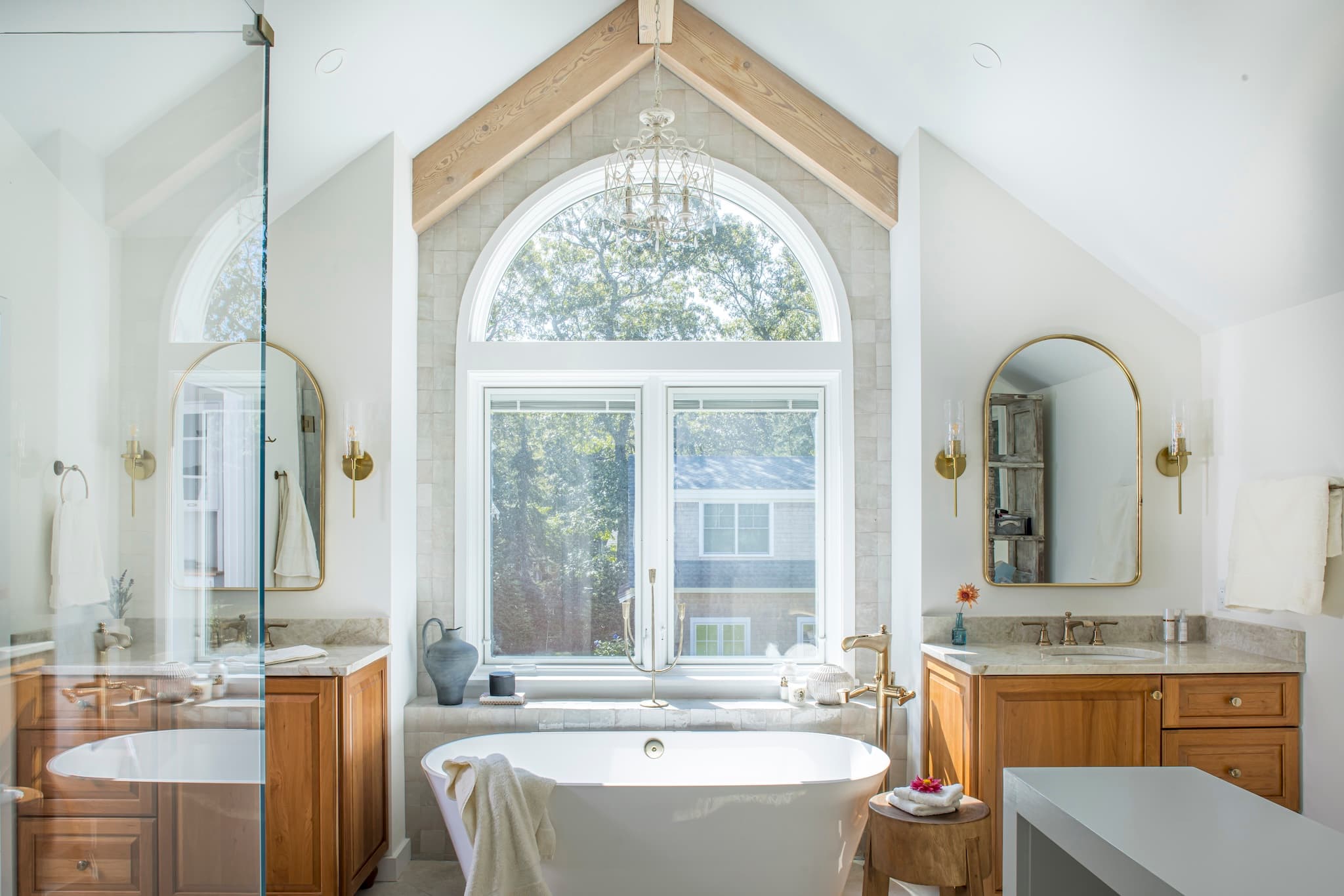 Stunning, modern en suite with large windows, marble finishes, and exceptional craftmanship