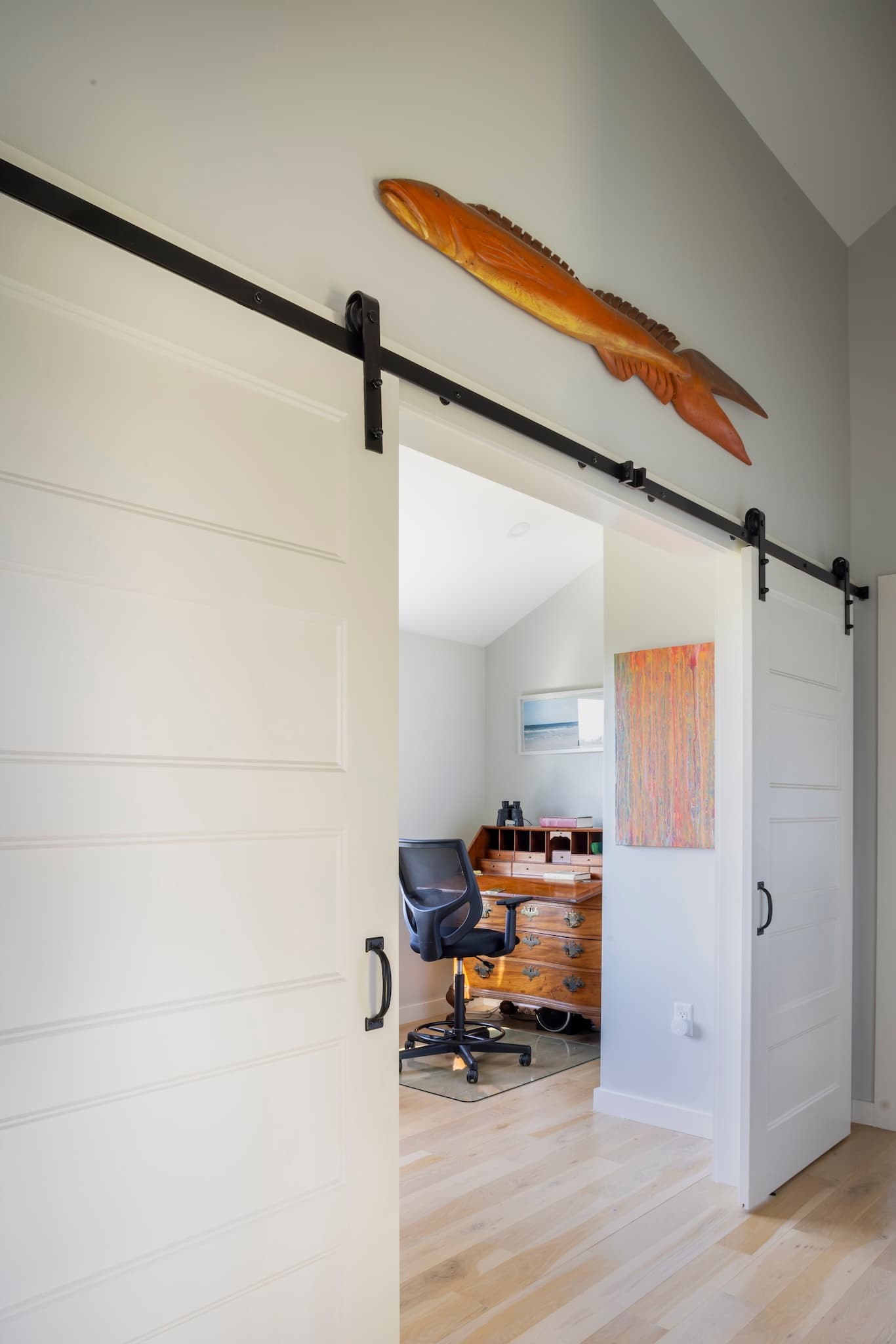 Sliding barn door constructed as the entry to a home office